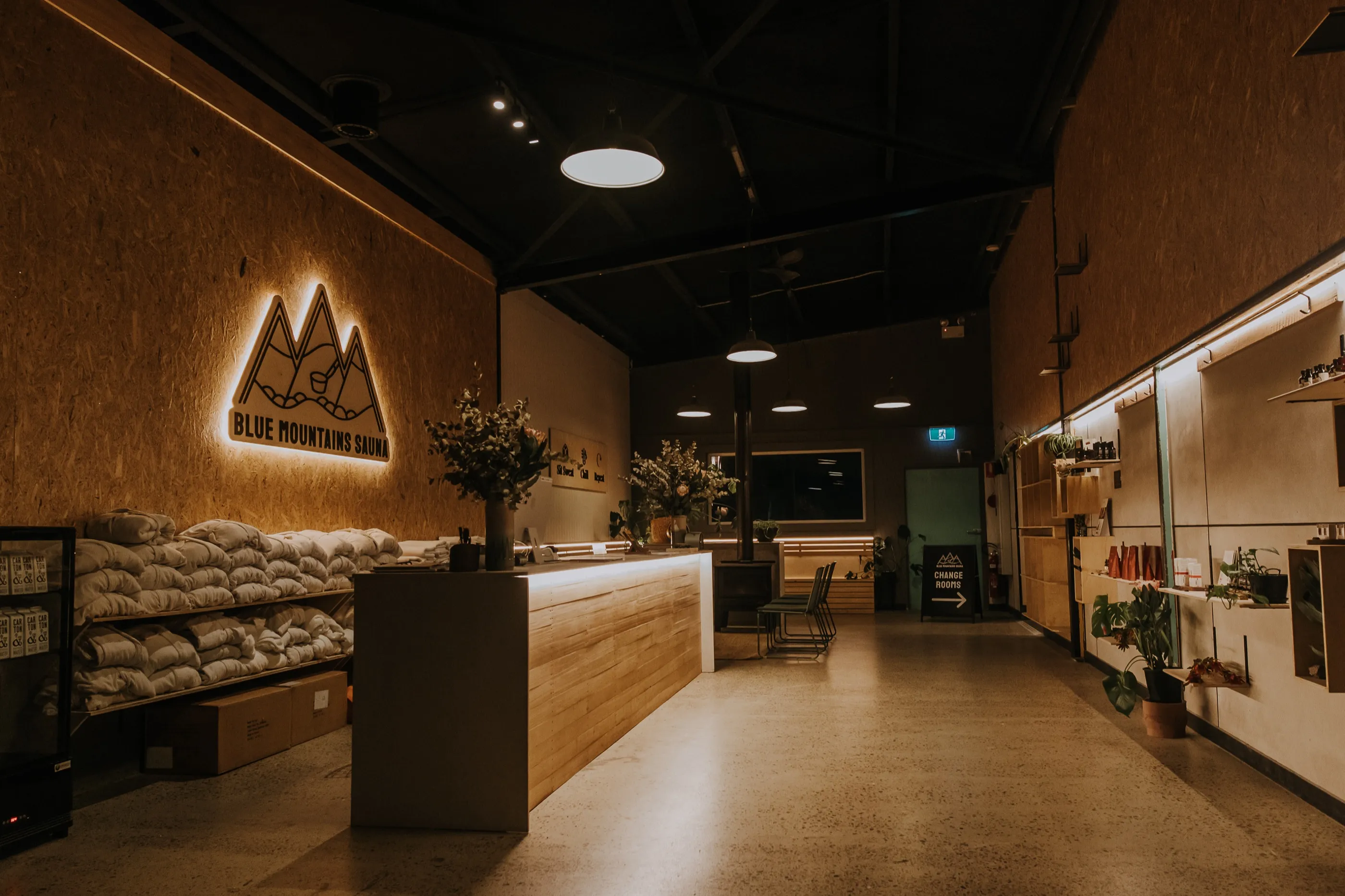Inside Blue Mountains Sauna, a repurposed 1970s squash-court warehouse space in Leura, built from raw, reclaimed materials.