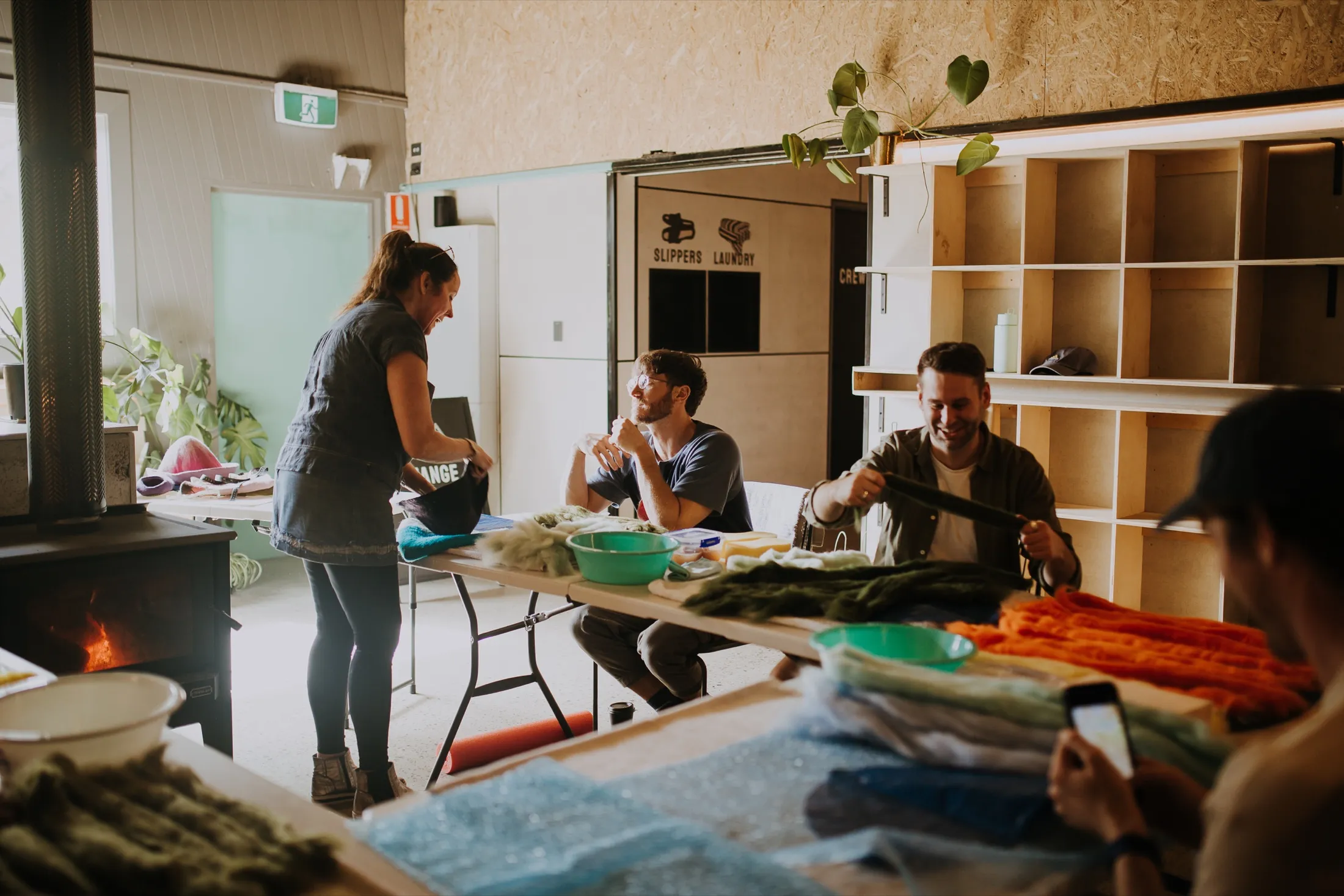Guests gathered at the long table in the warm, timber-lined upstairs space