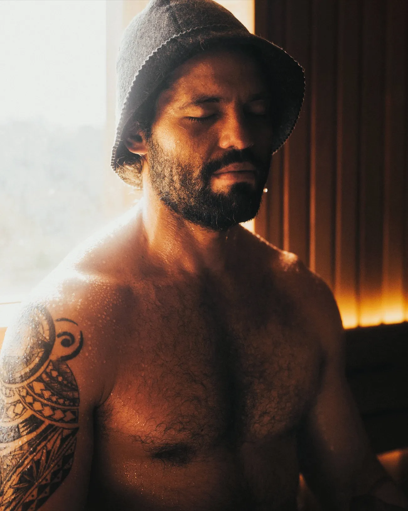 A man relaxing in the sauna during a men's wellbeing session