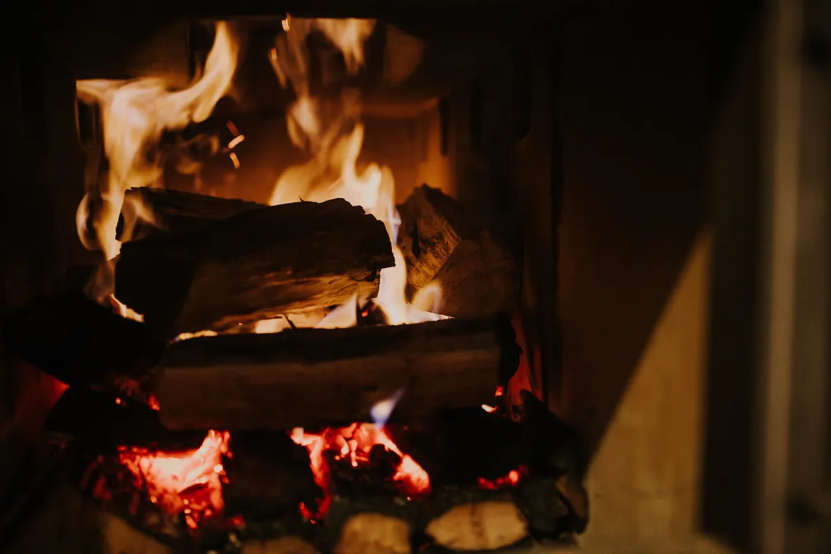 Flames roaring in the wood-fired Savu smoke sauna at Blue Mountains Sauna