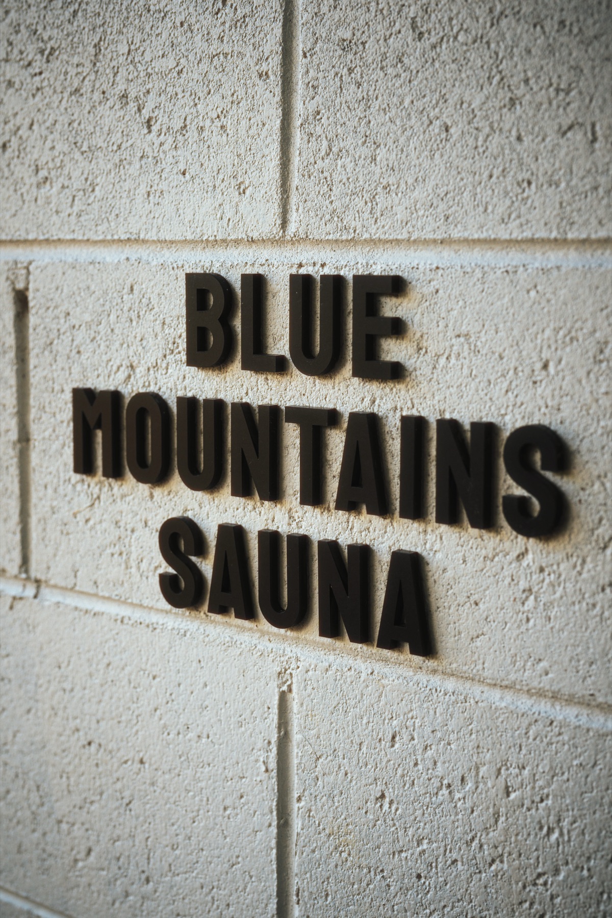 Blue Mountains Sauna signage on timber
