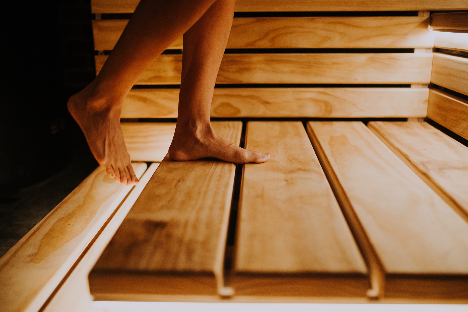 Bather stepping onto the Savusauna benches