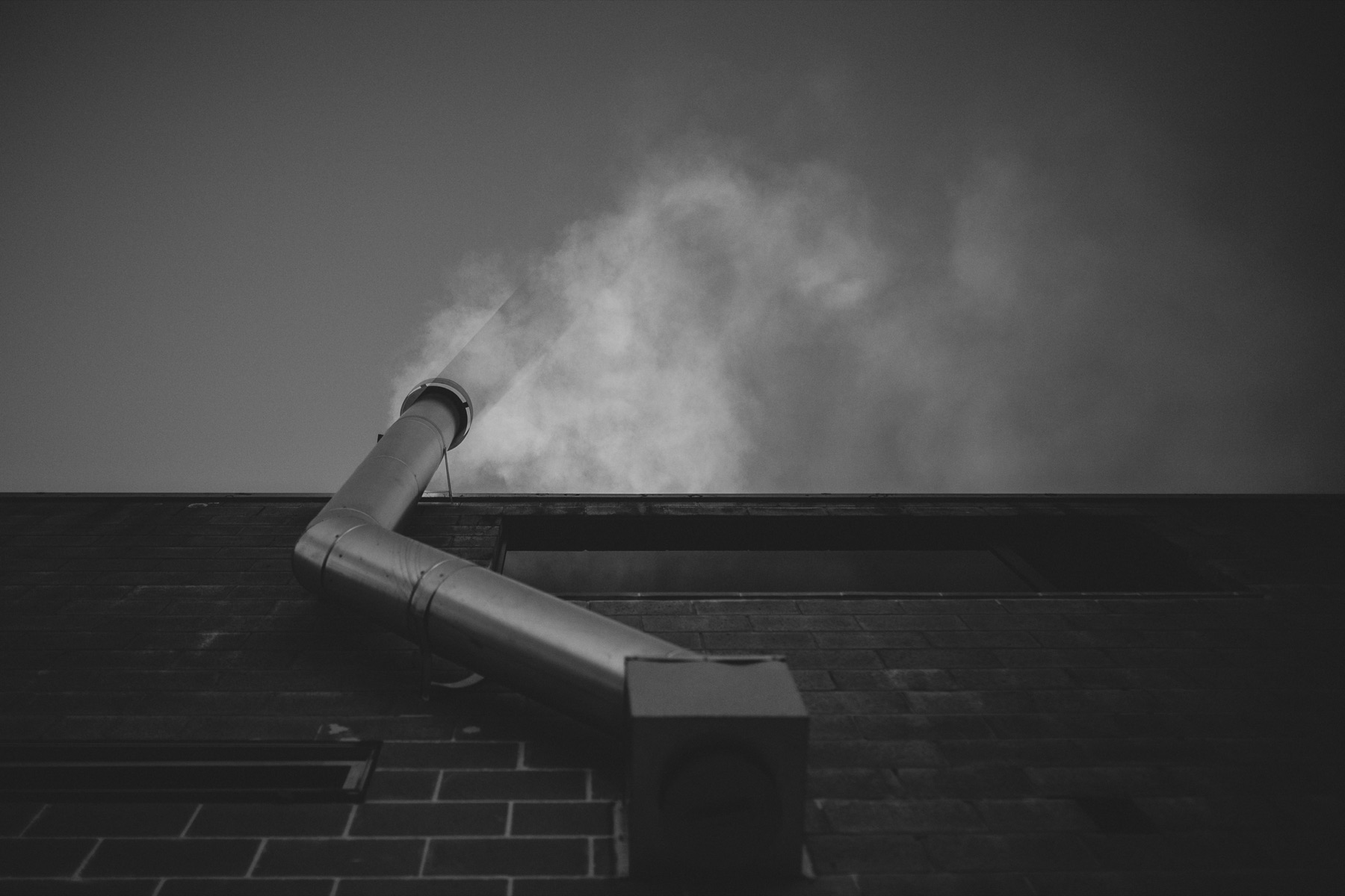 Steam rising from the sauna chimney