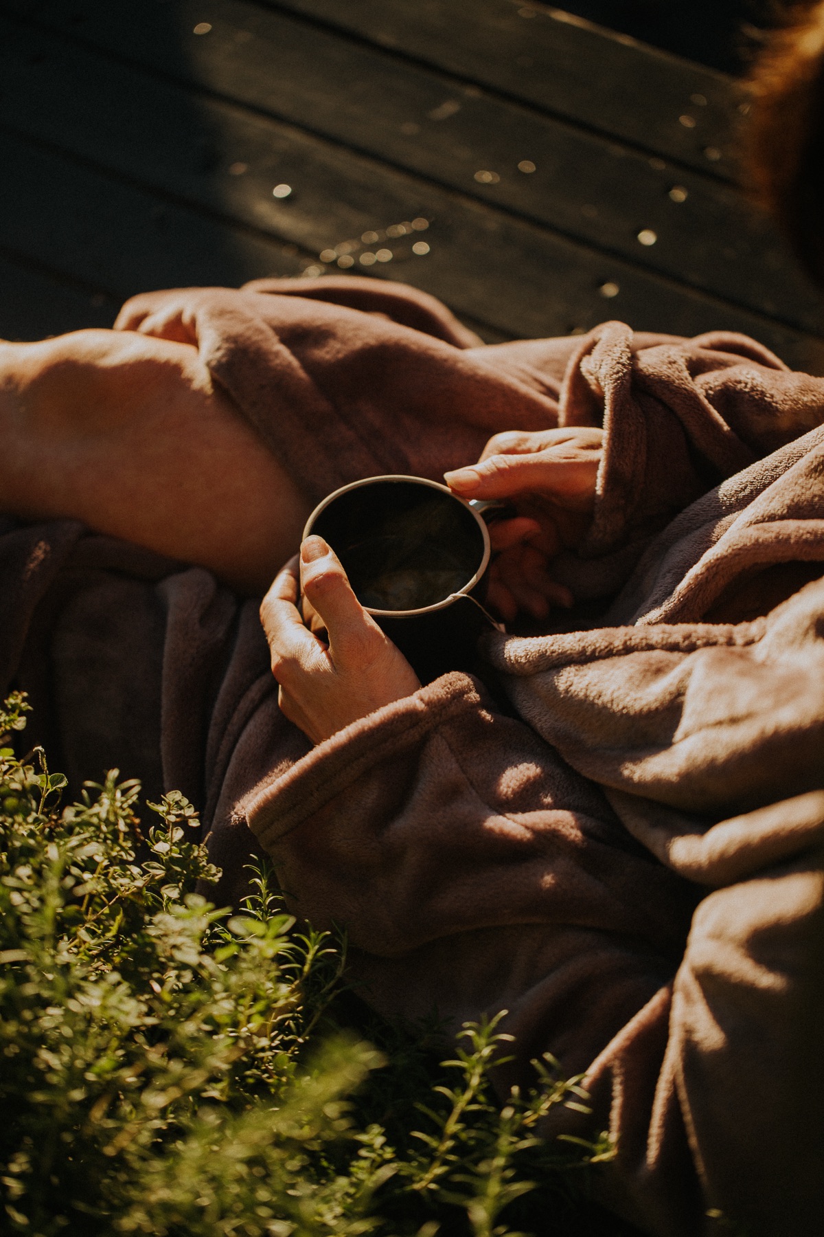 Bather in a robe with tea