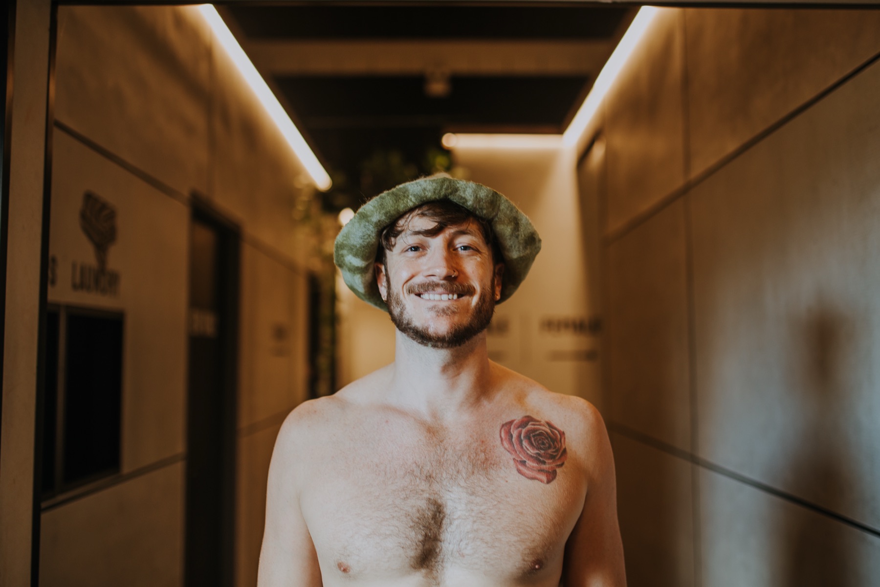 Guest smiling in a handmade felt hat